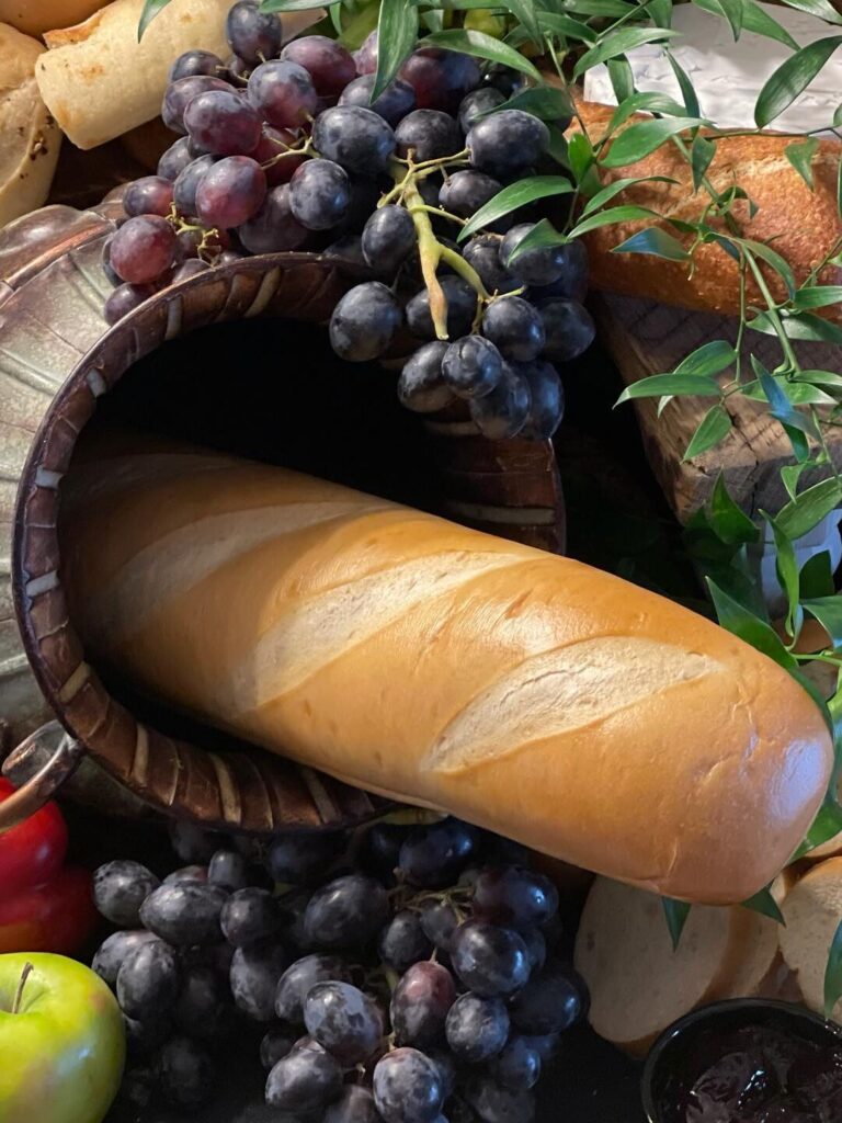 closeup of bread loaf and grapes