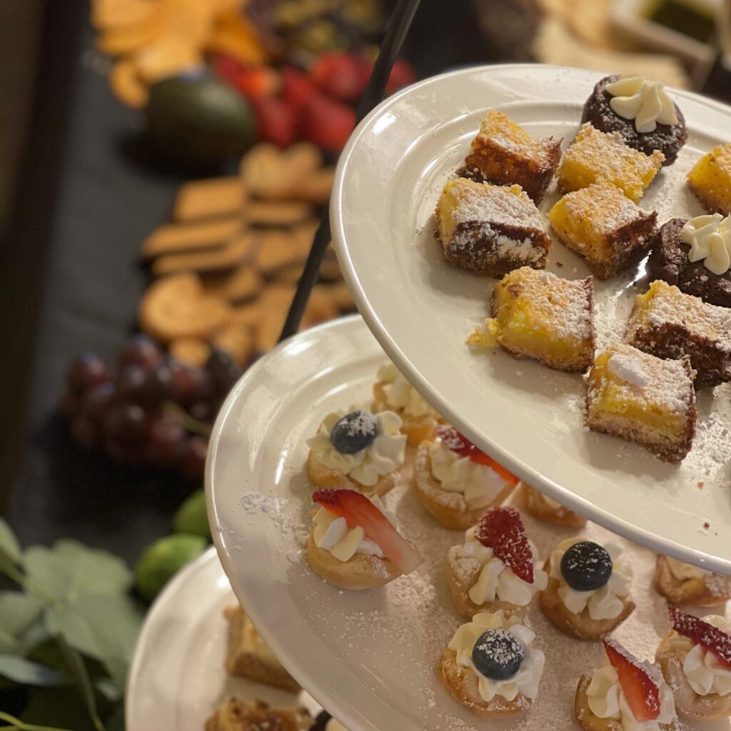 closup of small ckae bites with fruit and powdered sugar