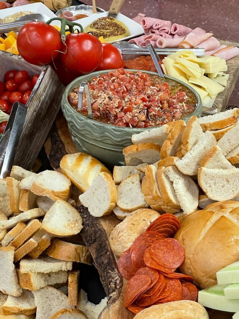 closeup of appetizer display with salsa, bread, meat, and more